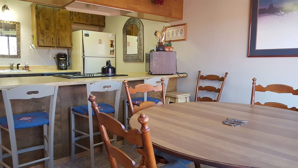 Dining Room table can seat 6 and breakfast bar seats an additional 4 people