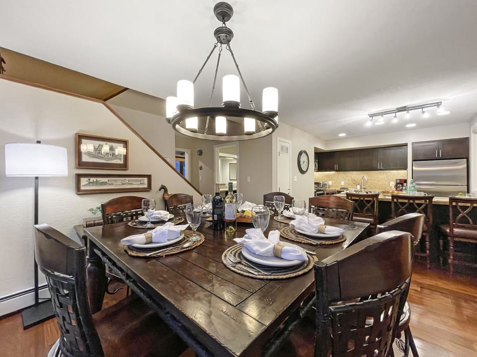 Gather for a meal together at the dining table with seating for 6 and 3 extra seats at the kitchen island