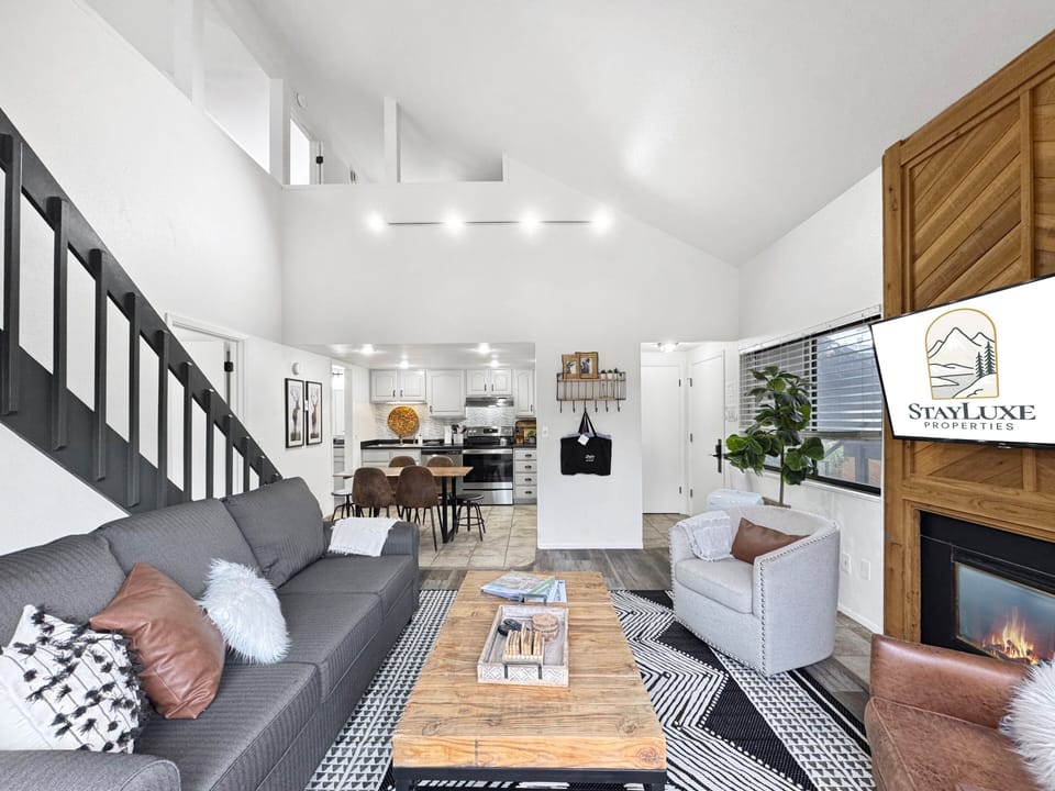 Spacious living room with soaring vaulted ceilings.