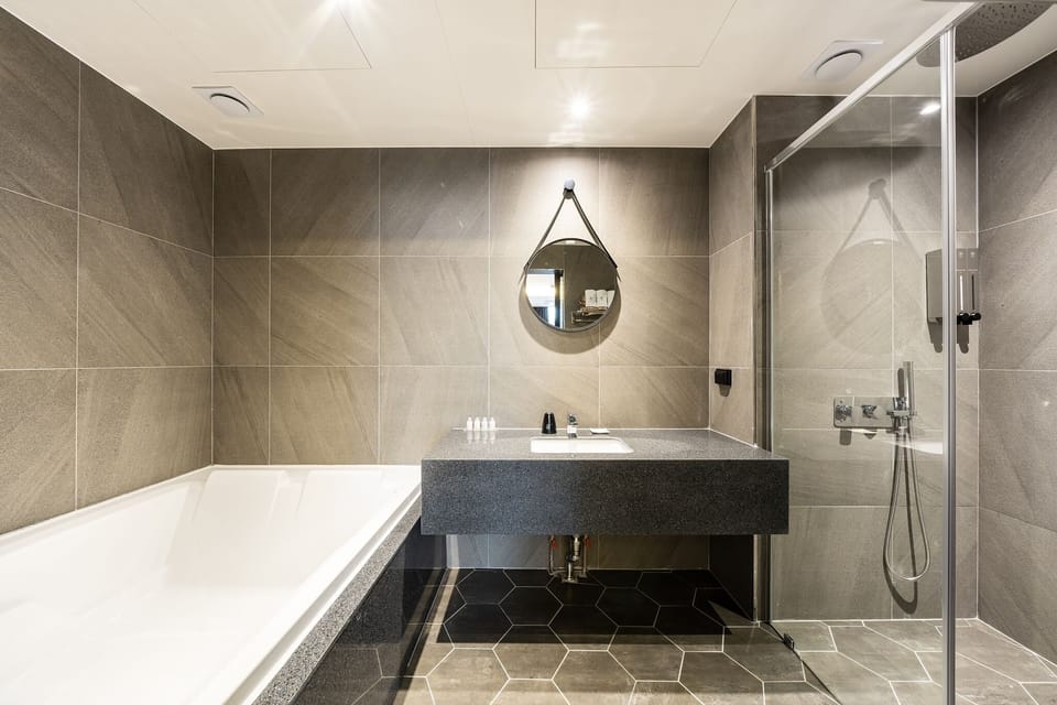 Separate tub and shower, hair dryer, bathrobes, slippers