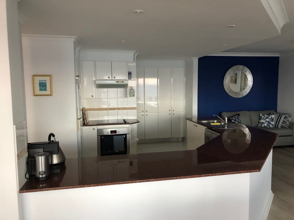 Kitchen with separate laundry behind