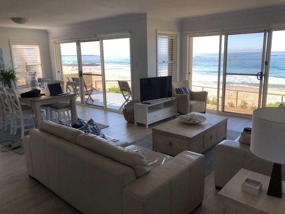 Lounge and Dining area looking out to beach and ocean