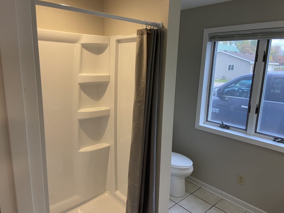 Hallaway Bathroom with a walk in shower