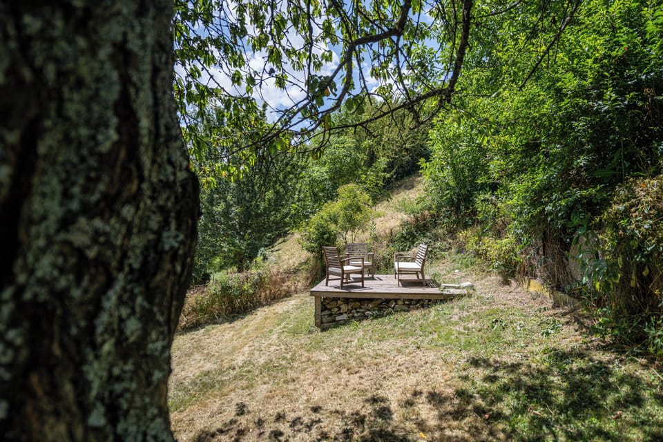 At the rear of a garden is a terrace where you can sit with views of the valley.