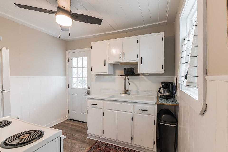 Kitchen with tongue and groove ceiling.