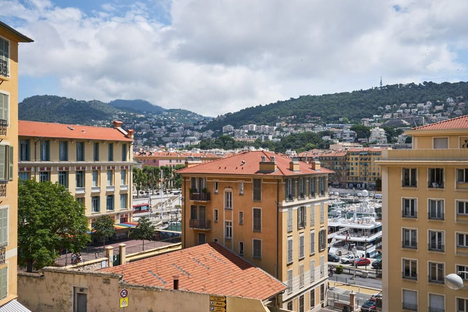 Enjoy the view of the port and hills from the balcony