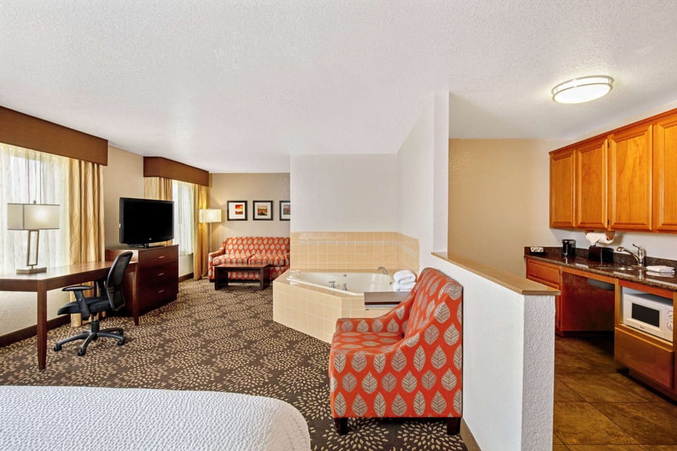 Deluxe Studio Suite, 1 King Bed, Accessible, Pool View (Mobility Accessible, Non-Smoking) | Premium bedding, desk, laptop workspace, blackout drapes