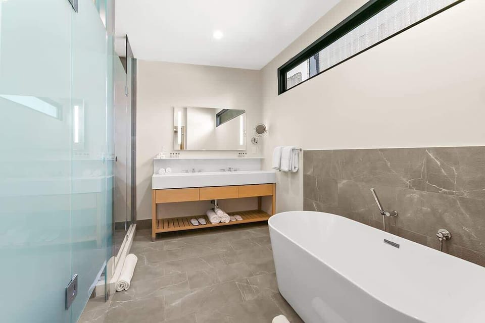 Each bathroom holds all of your everyday essentials such as Beekman toiletries, clean linens and slippers