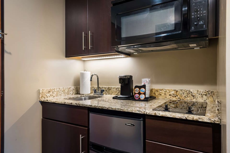 Fridge, microwave, coffee/tea maker, cookware/dishes/utensils