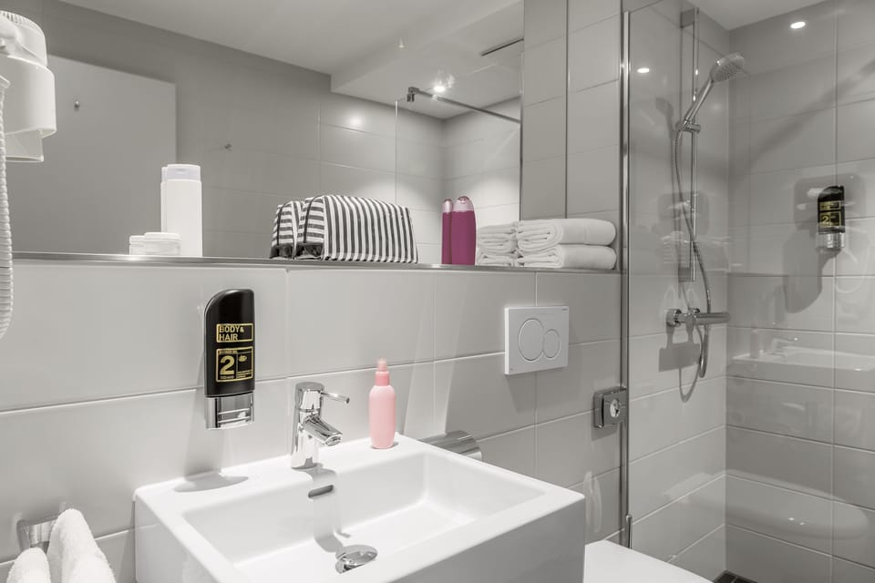 Shower, hair dryer, towels, soap