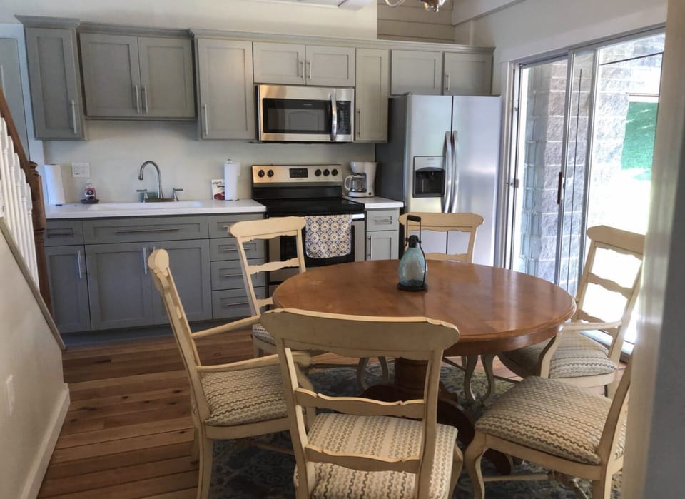 New stainless steel appliances & great table for gathering to eat or play cards
