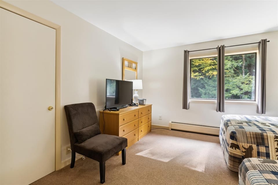 Lie in bed and watch the flat screen tv.