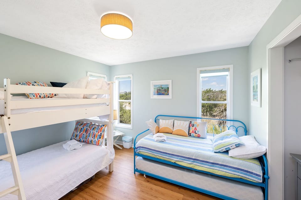 Main level kids bunk room sleeps four with daybed and trundle
