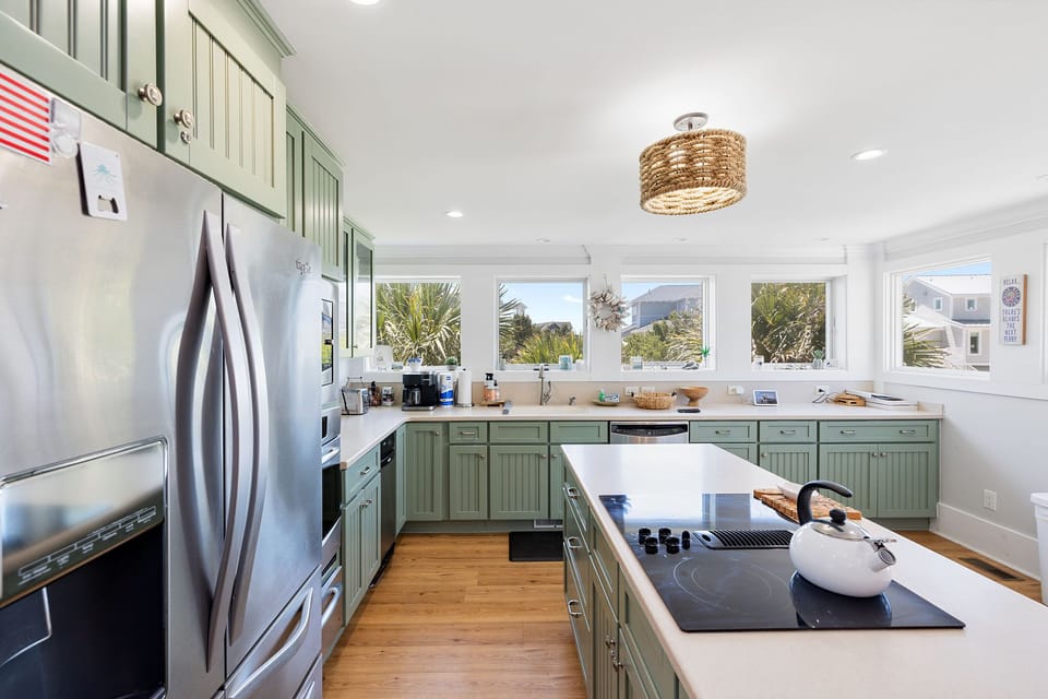 Modern kitchen with all amenities; open to living area & features ocean views

