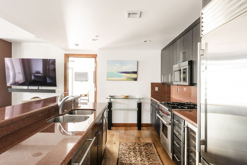 Fully equipped kitchen, granite countertops and stainless steel appliances, gas range and over the range microwave