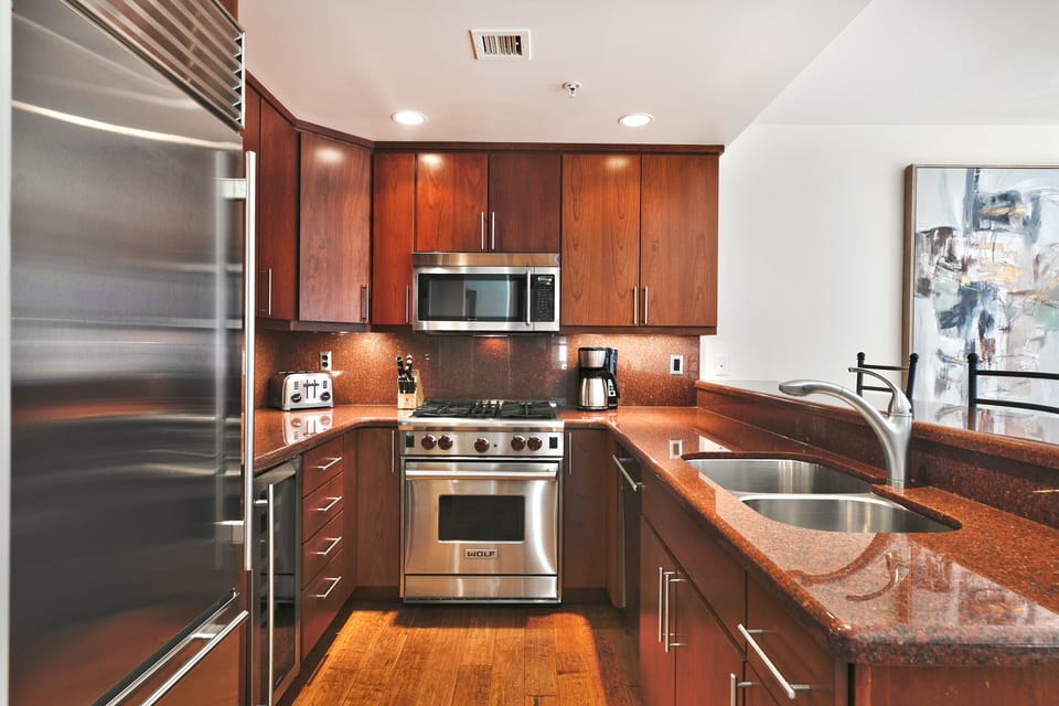 Chef's kitchen with gas stove, over range microwave, coffee maker and everything you need to cook or dine in