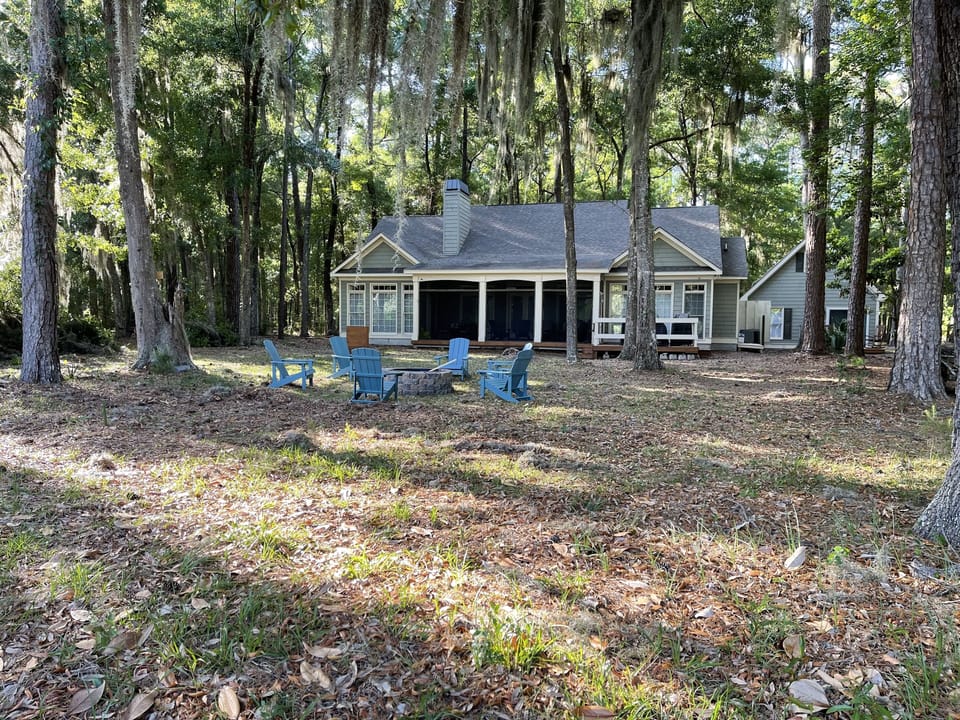 Back of Vacation Home with fire pit, horseshoes and cornhole