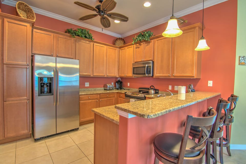 The Bright Kitchen Has a Bar Height Counters