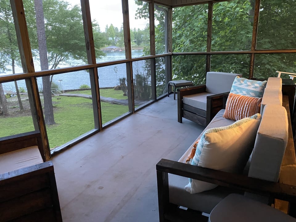 sitting area of screened in porch