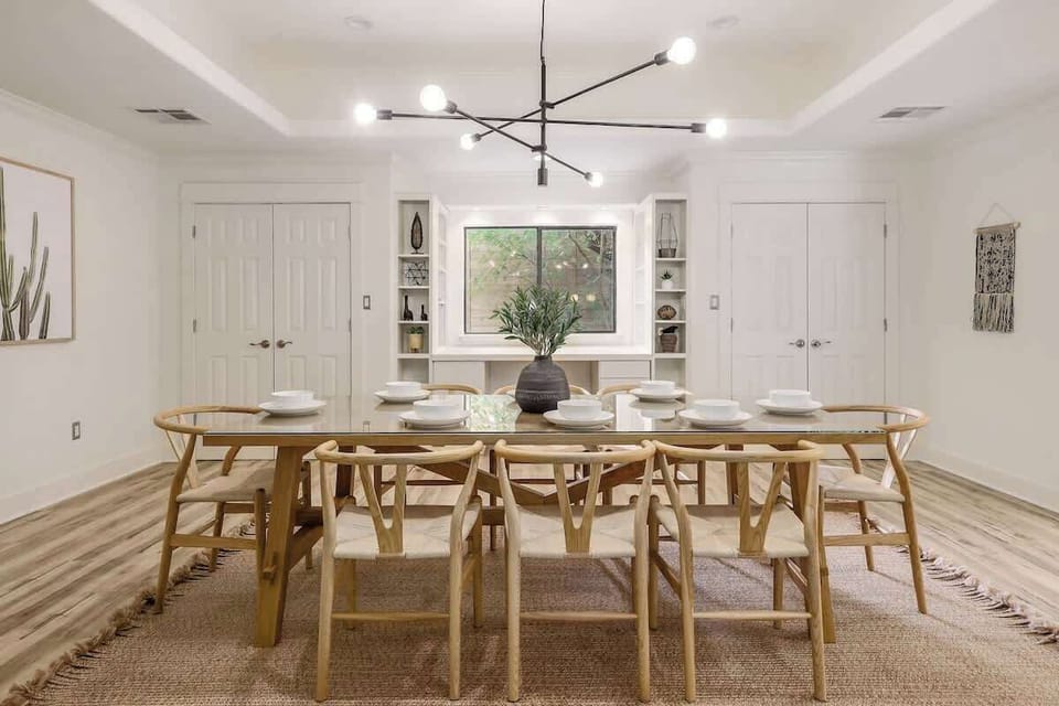Past the kitchen is another formal dining room with seating for 8, as well as a full guest bathroom with a walk-in shower.