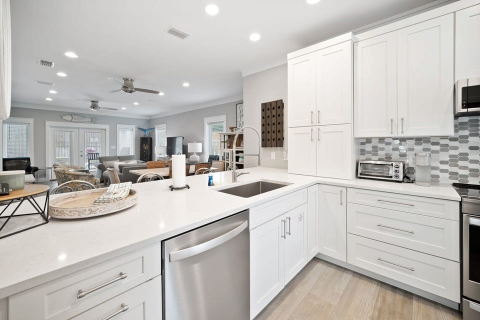 Beautiful kitchen with lots of storage and stainless steel appliances.
