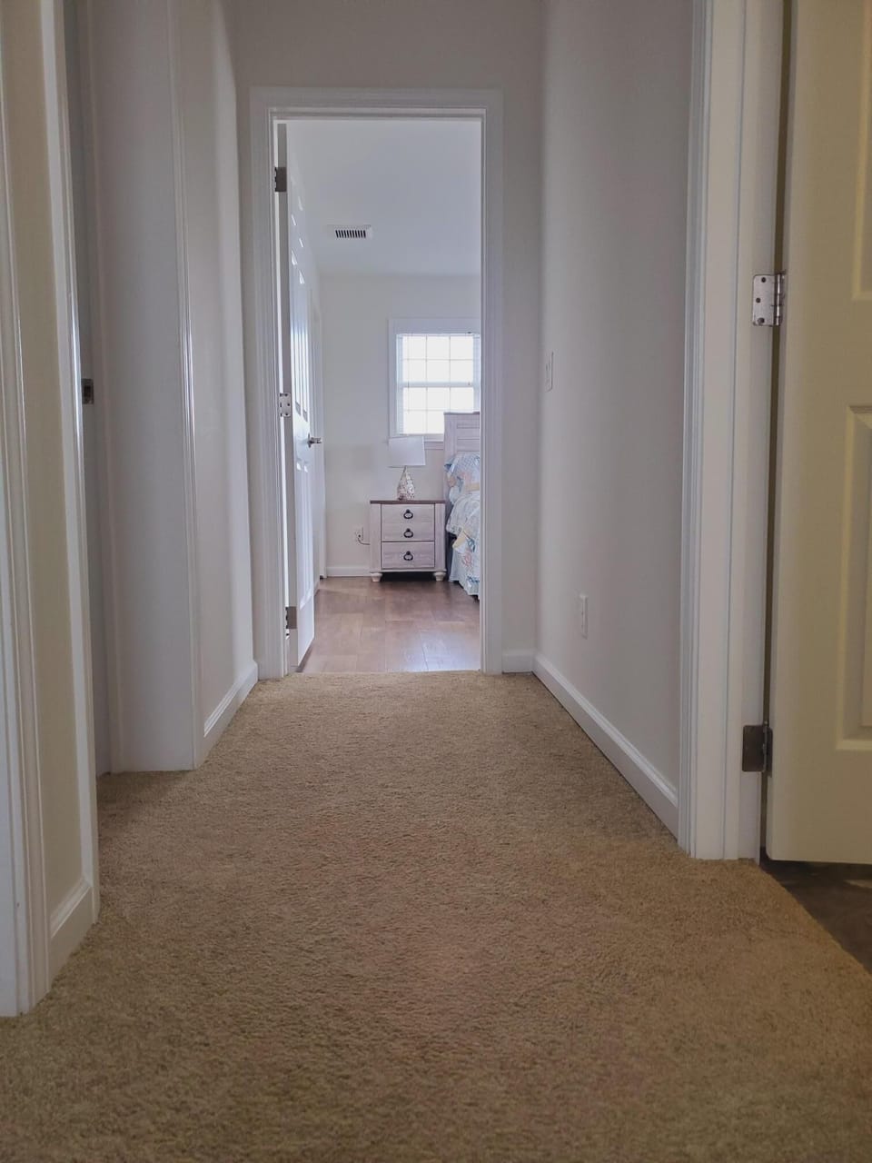 Hallway to 3 bedrooms and 2 bathrooms