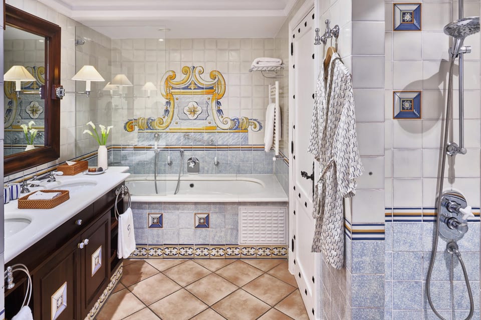 Designer toiletries, hair dryer, bathrobes, slippers