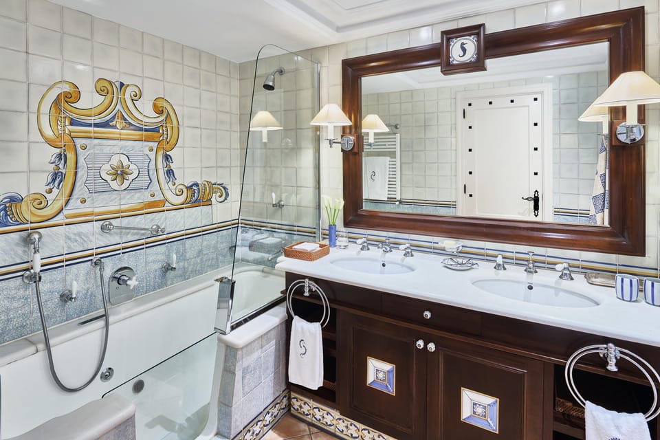 Designer toiletries, hair dryer, bathrobes, slippers