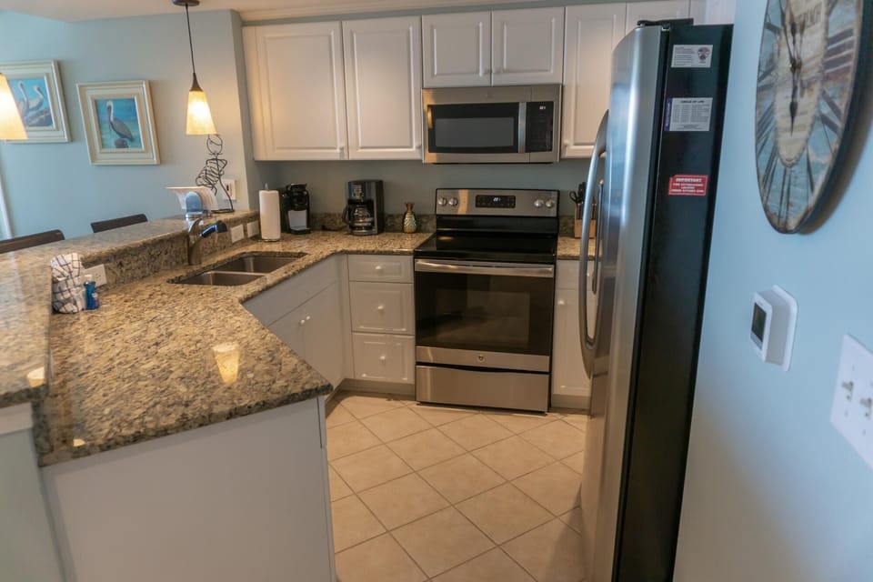 Modern kitchen with granite countertops and stainless steel appliances