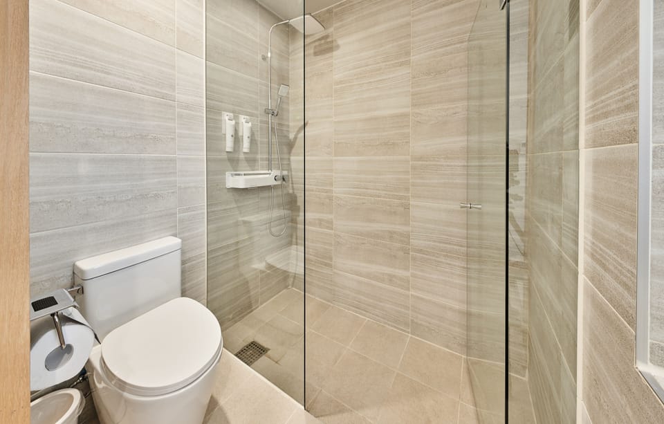 Shower, rainfall showerhead, hair dryer, towels