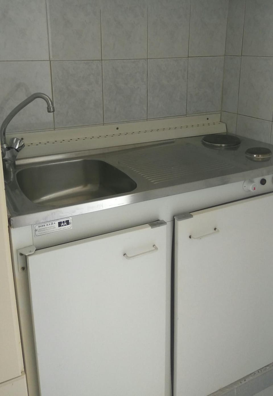 Mini-fridge, stovetop, electric kettle, cookware/dishes/utensils