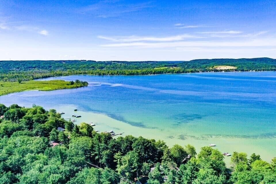 Drone photo showing the shallow and sandy shoreline of Big Platte Lake
