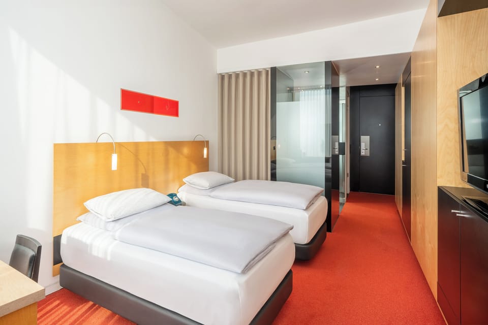 The Innside Twin Room | Hypo-allergenic bedding, free minibar, in-room safe, desk