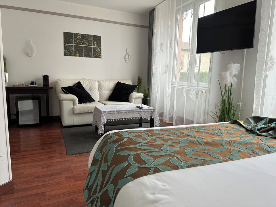 Junior Suite | Living area | 65-cm Smart TV with cable channels