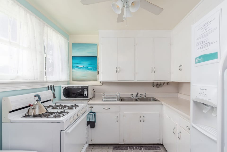 Kitchen - Full size GAS stove, microwave, refrigerator, lots of counter space. No dishwasher.