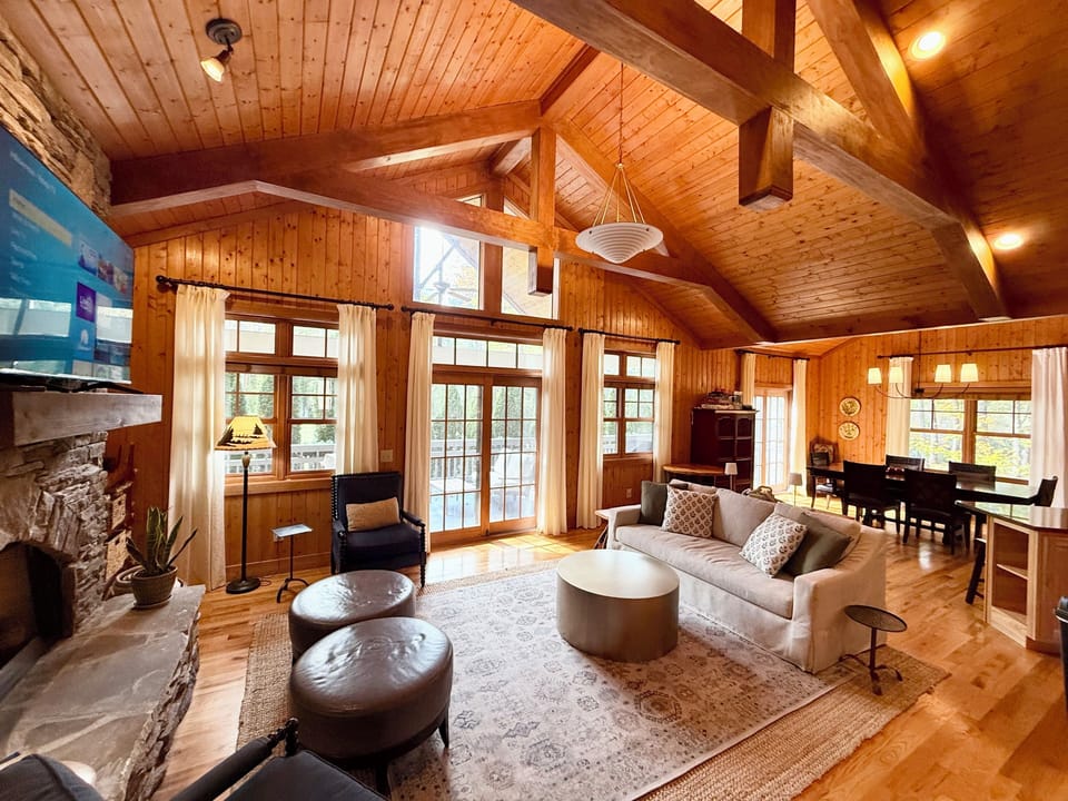 Inviting living room w designer seating, smart TV, and indoor gas fireplace.