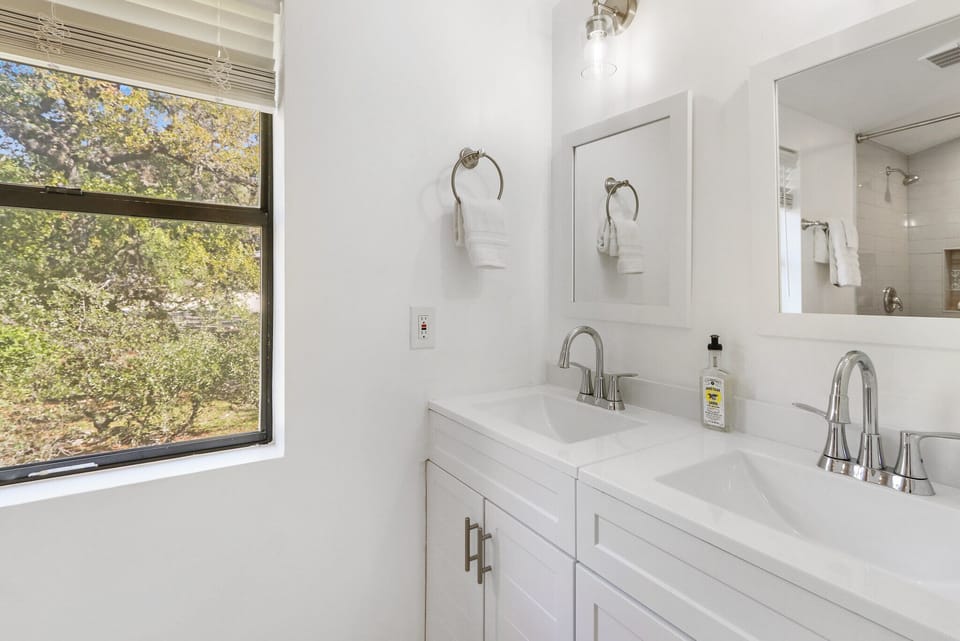 Full bathroom with dual vanities