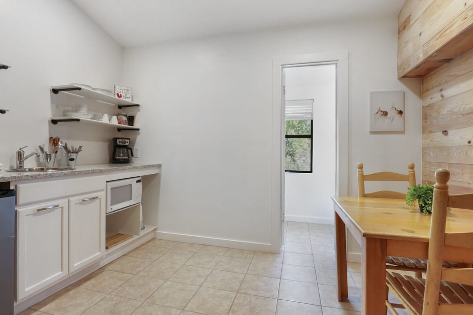 Newly renovated kitchenette area with a coffee bar, microwave, and minifridge