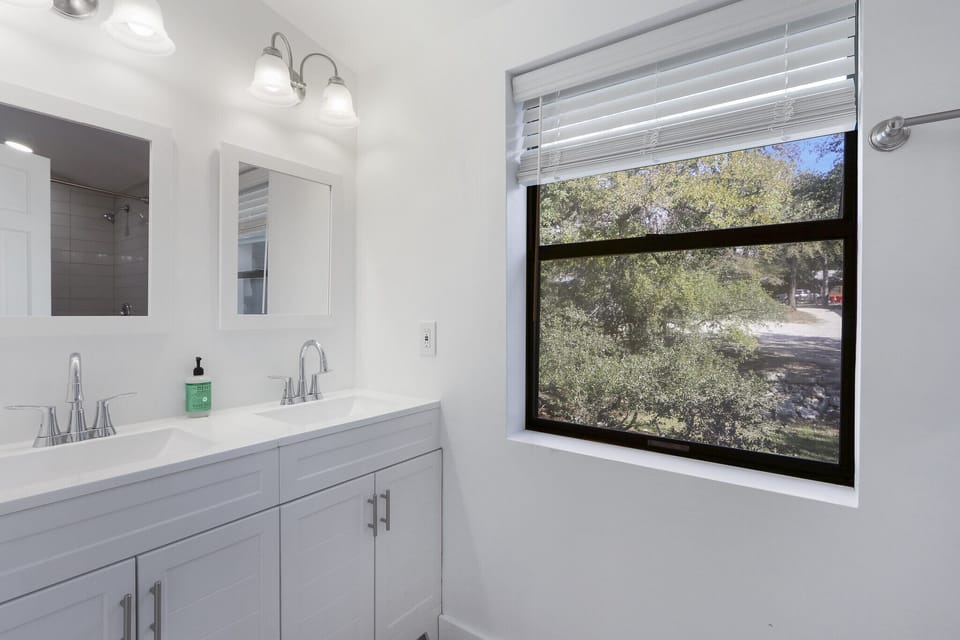 Full bathroom with dual vanities