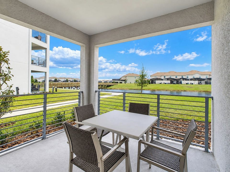 Covered Patio with Outdoor Dining and Scenic Lake Views