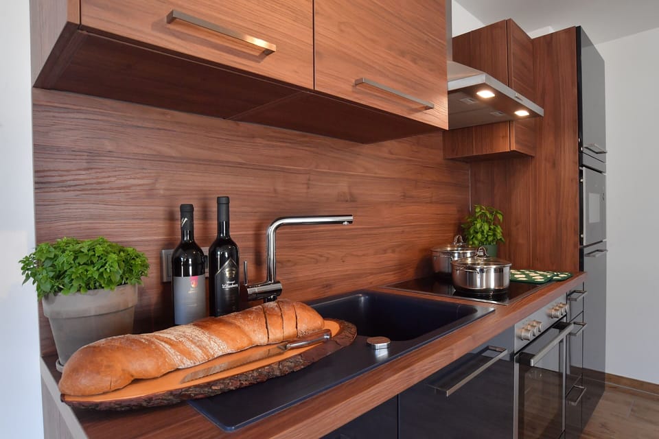 Superior Apartment (5) | Private kitchen | Espresso maker, coffee/tea maker, electric kettle, highchair