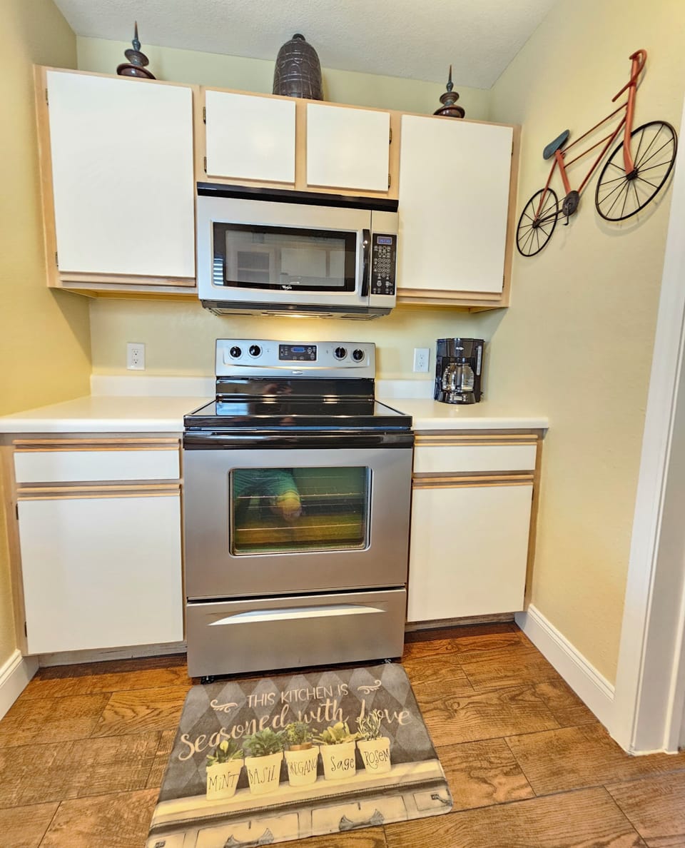 Large kitchen, full-sized appliances, & fully stocked with everything needed!