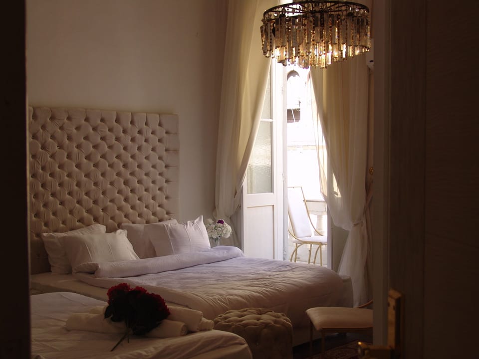 Family Room With Balcony | Hypo-allergenic bedding, desk, free rollaway beds, bed sheets
