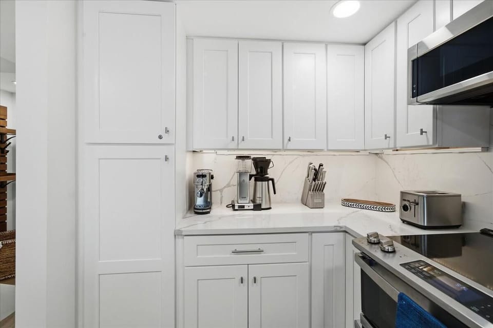 Bright, modern kitchen with sleek appliances and ample storage