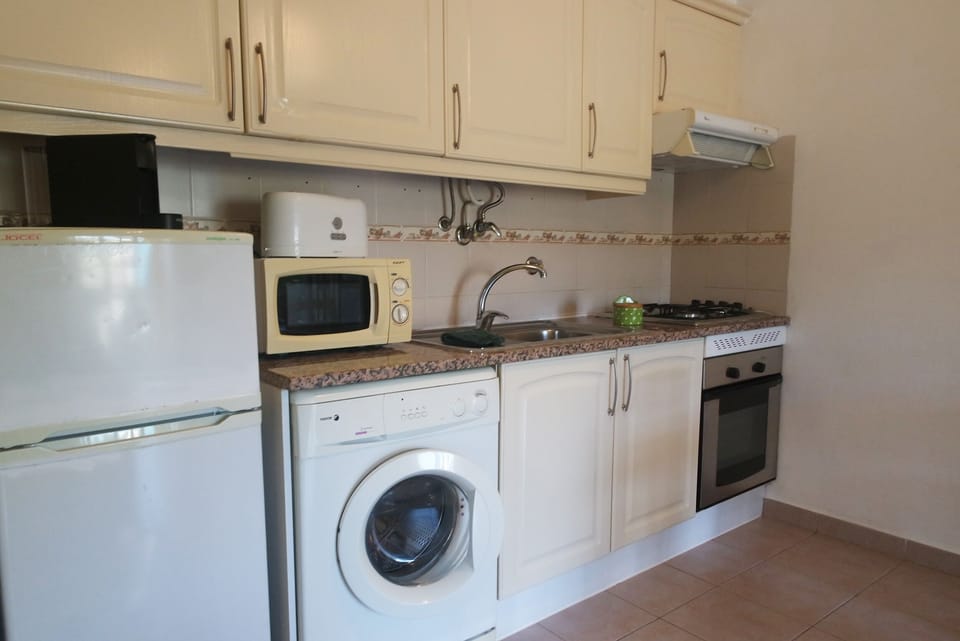 Apartment, 1 Bedroom | Private kitchen | Full-size fridge, stovetop, cookware/dishes/utensils