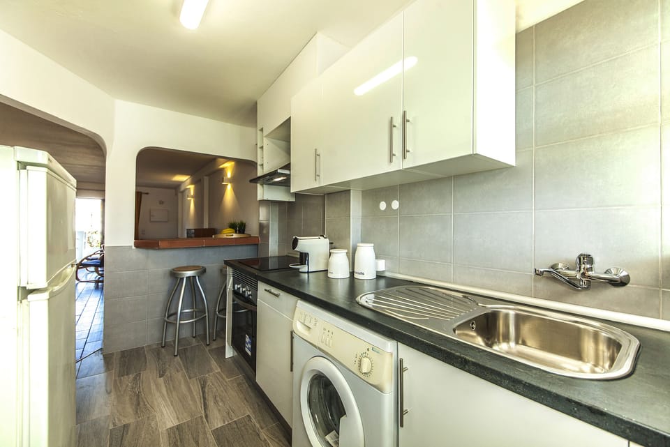 Apartment, 2 Bedrooms | Private kitchen | Full-size fridge, microwave, stovetop, electric kettle