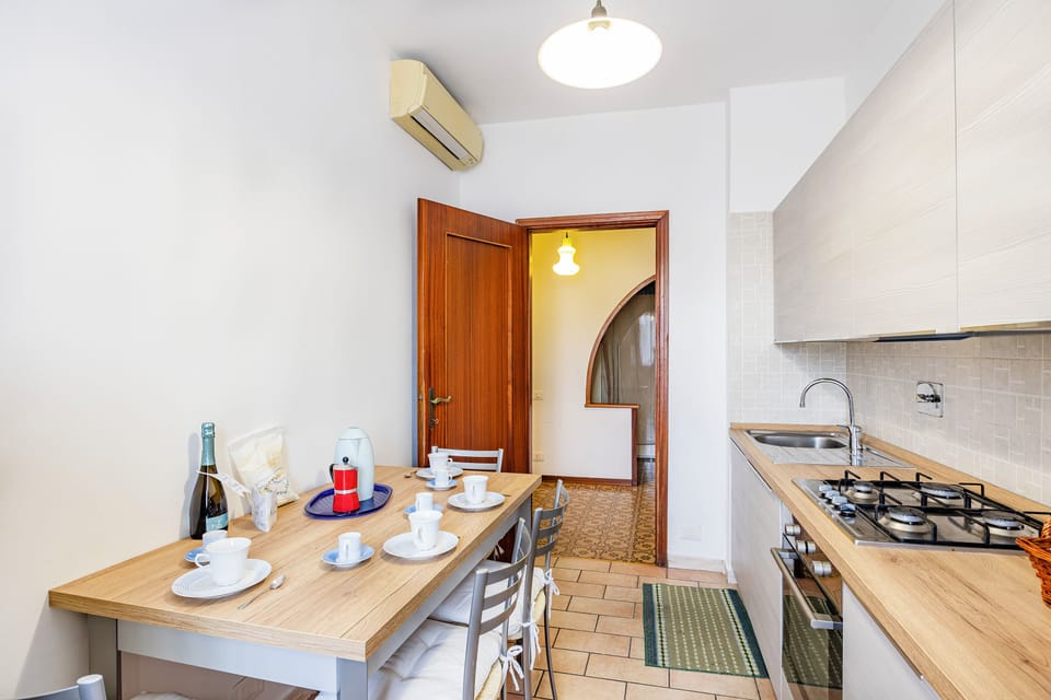 Family Apartment, 1 Bedroom, Balcony (Casa Arno 500m from beach) | Private kitchen | Full-size fridge, microwave, oven, stovetop