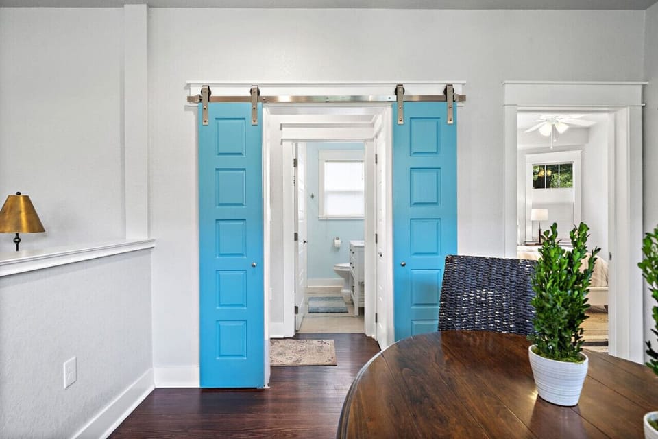 The Guest bedroom and bathroom can be closed off with these cute farm doors!