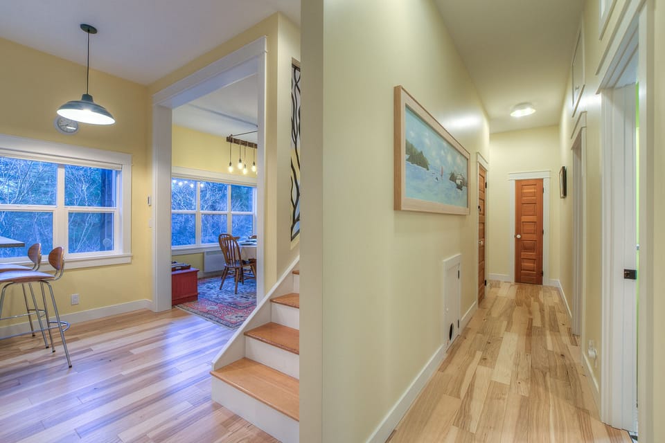 The stars up to the second floor. The door to the right is the downstairs bath