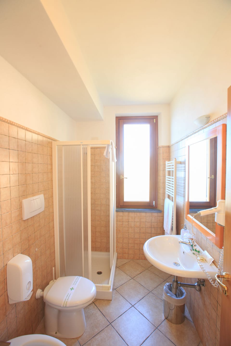 Shower, rainfall showerhead, designer toiletries, hair dryer